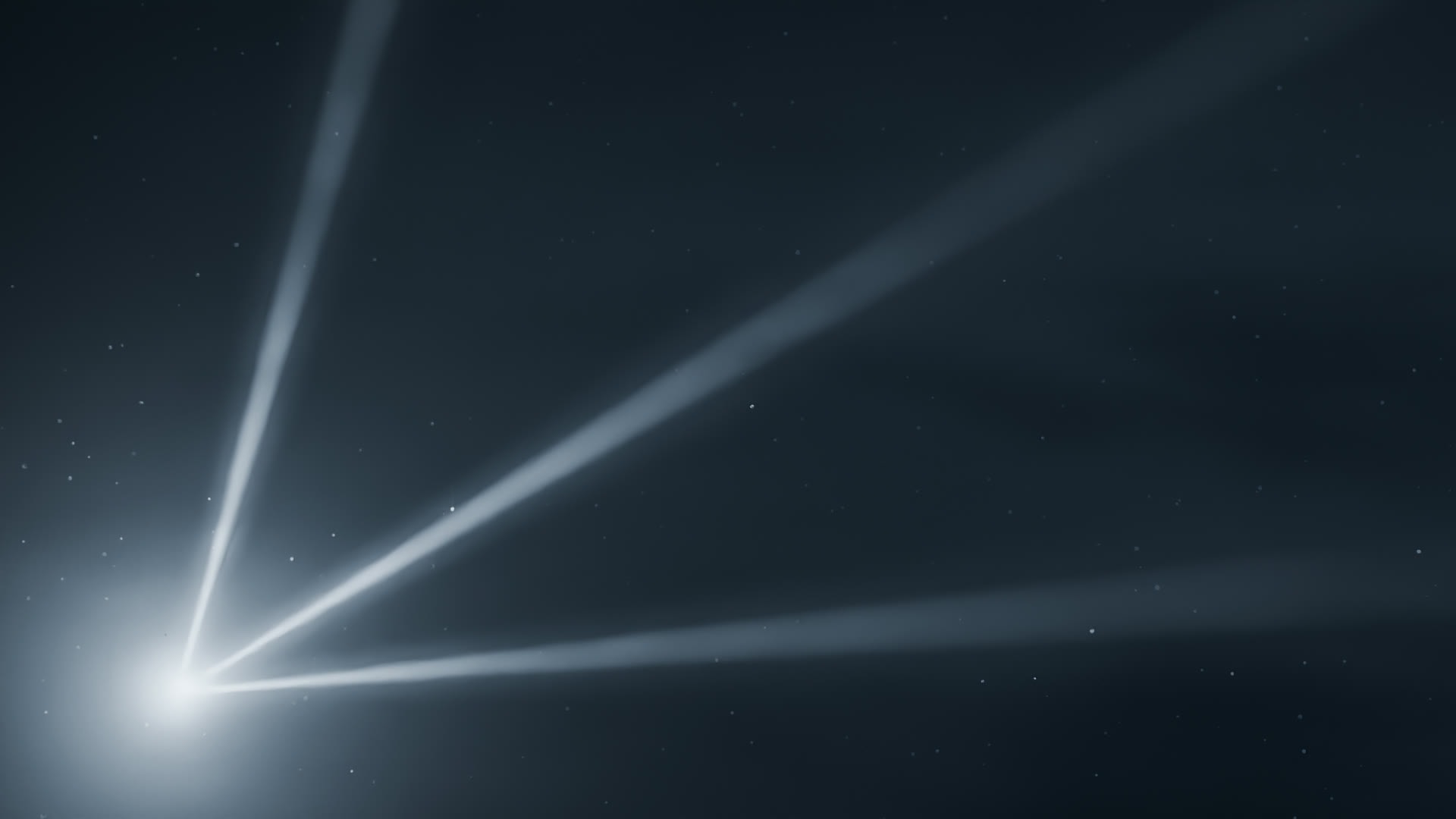 Three beams of steel-blue light fanning through fog